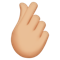 Hand with Index Finger and Thumb Crossed- Medium-Light Skin Tone emoji on Apple